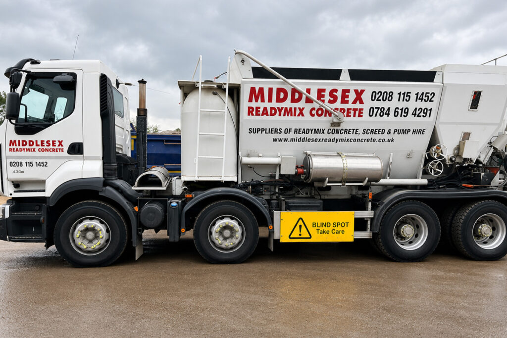 Ready mix concrete mixer truck delivering concrete