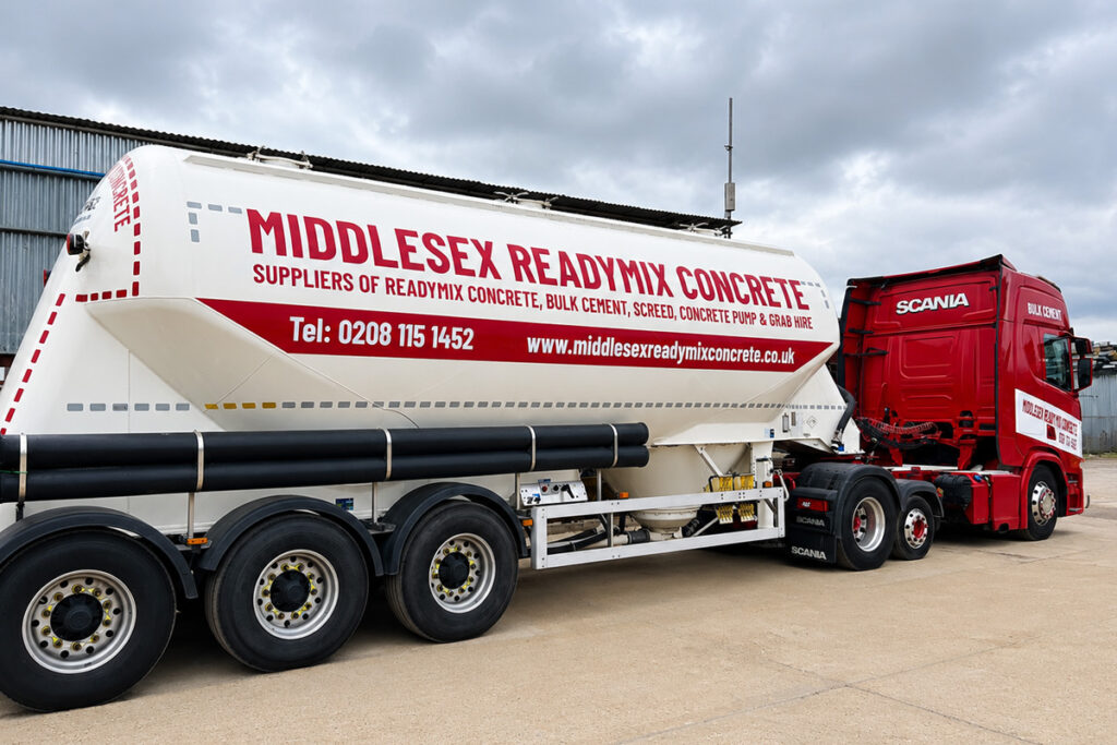 Concrete pump delivering concrete at a construction site in London